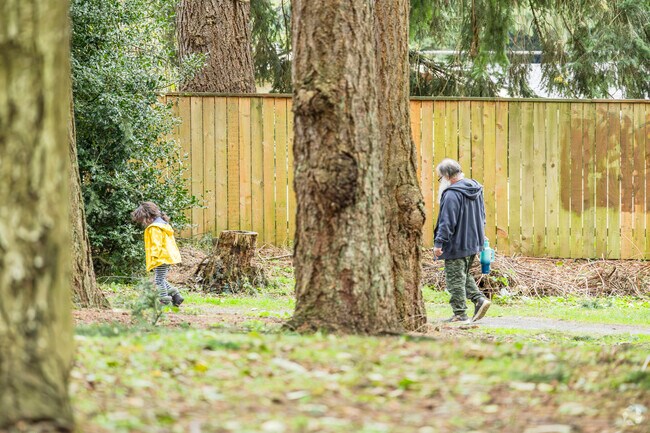 Lake Grove Park is a heavily wooded area with a playground for the kids in Mirror Lake.