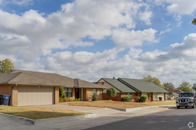 Homes in Macklanburg Park often have brick exteriors and attached garages.