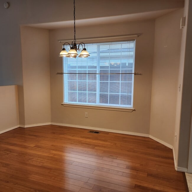 Well lit dining area plus breakfast bar.