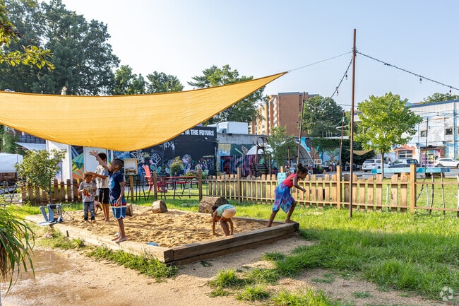 Residents young and old spend the nice days in Belmont at IX Art Park.