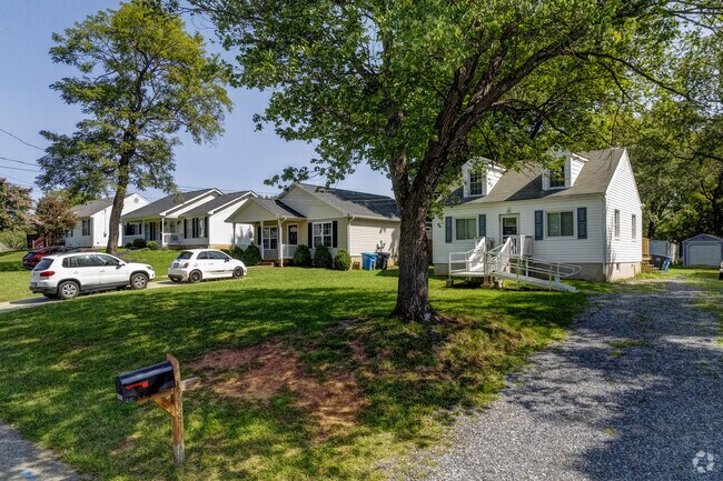 The neighborhood’s tree-lined streets enhance the ranch-style aesthetics.