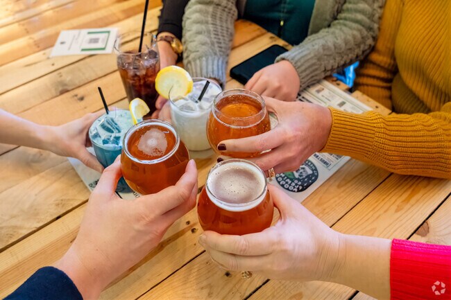 Friends celebrate the arrival of the weekend at Voodoo Brewing in Houston PA.