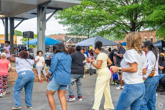 Residents enjoy dancing at the Black Bartow Day Party.