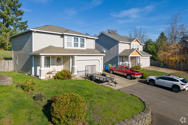 The light shines nicely on these modern Craftsman-style homes in Salem Hills.