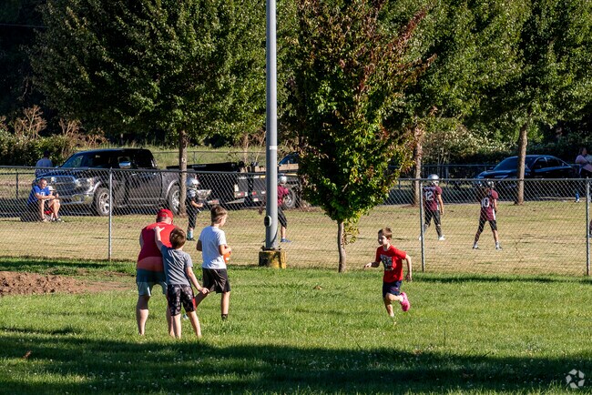 A family playing football at River Bend Park.