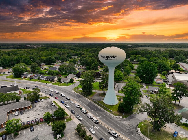 A water tower overlooks Greenbrier West at sunset.