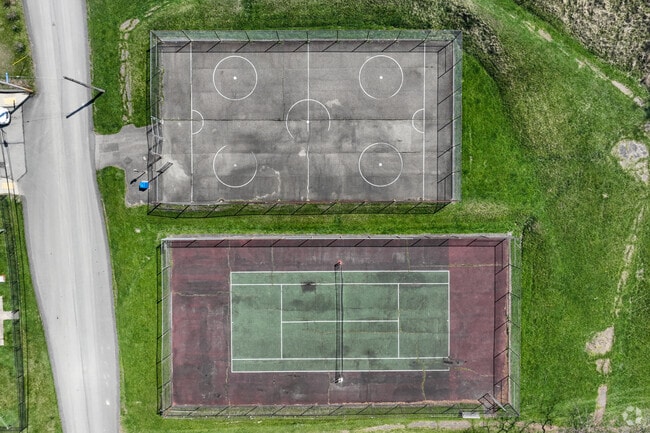 Enjoy a game of tennis or basketball at Officer Eric Kelly Memorial Field.