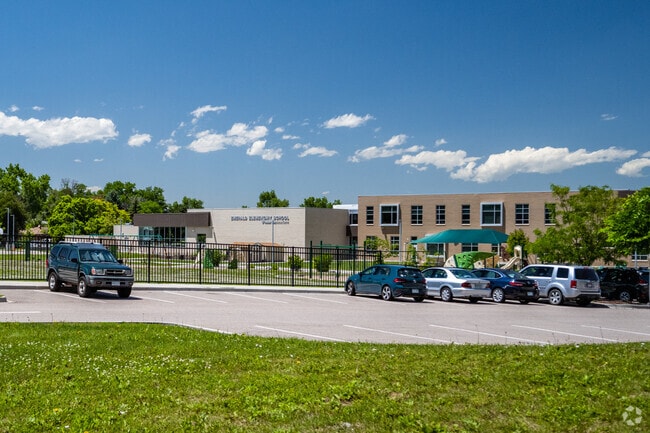 The front parking lot and entrance at Emerald Elementary School in Broomfield, Colorado.