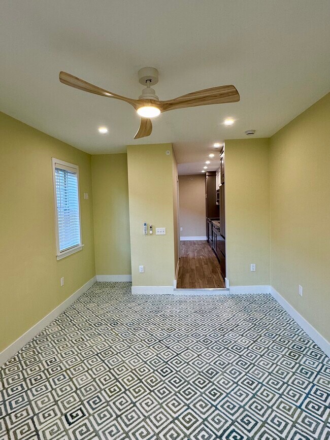 Living room with stylish ceiling fan/light