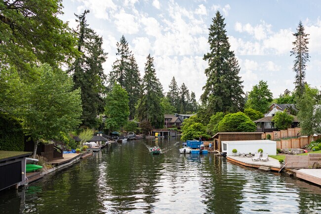 Oswego Canal lined with docks and boat garages in the Bryant Neighborhood.