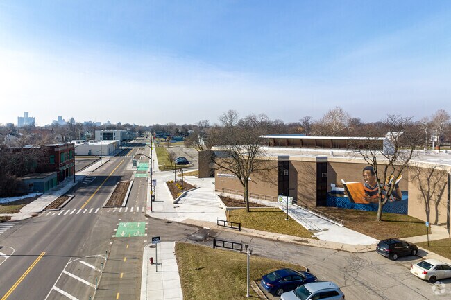 Kercheval Ave in Islandview features newly-added protected bike lanes & bus stops.