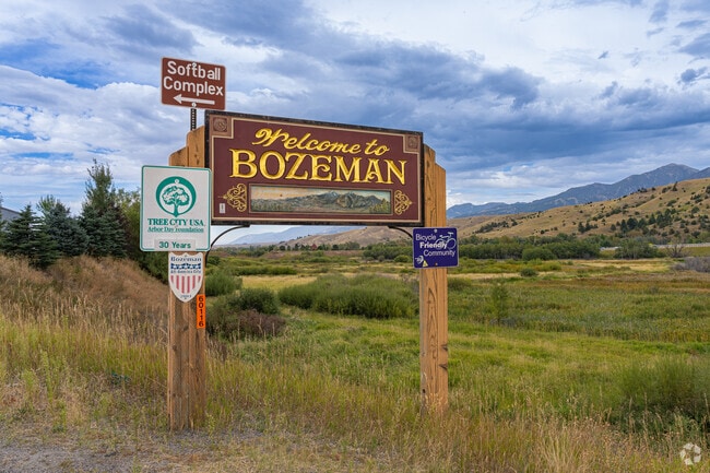 A beautiful wooden sign welcomes visitors to South Central and downtown Bozeman.