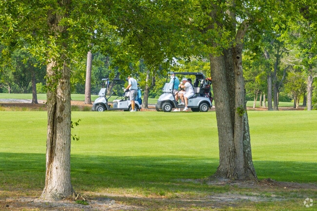 Golfers relax and prepare to tee off at Pine Lakes Country Club near Grande Dunes.