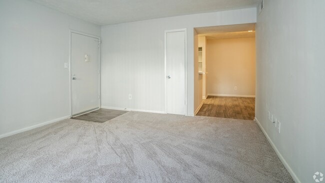 Spacious, open living room offering ample space and natural light for a comfortable living experience.