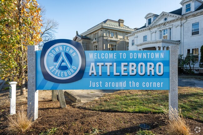 The "Welcome to Downtown Attleboro" sign greets you to a hub of historic charm.