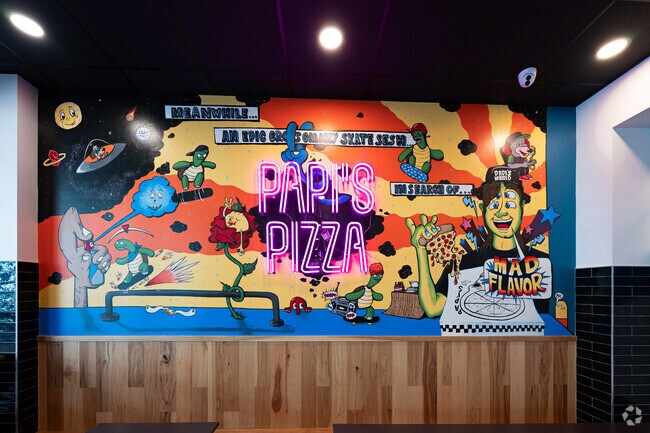 Many Downtown Fort Wayne restaurants feature wall murals like this one at Papi's Pizza.