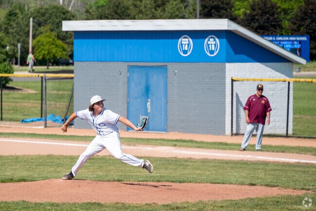 Oscar A. Carlson High School baseball game pitch.