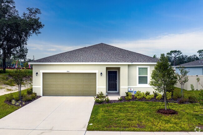 A bungalow-style home in Mims showcases a beautiful color scheme with fresh sod.