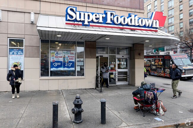 Sugar Hill residents grabbing groceries for the family from Super Foodtown.