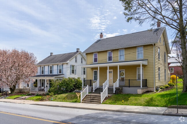 Twin colonials are situated along the main road of West 1st Ave in Parkesburg.