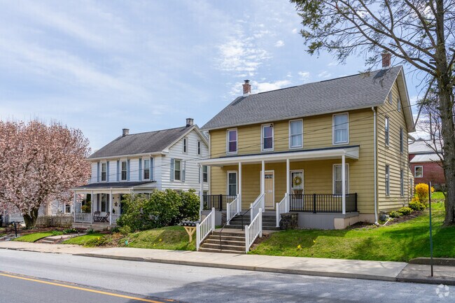 Twin Colonial homes line West First Avenue, contributing to Sadsbury Township’s historic streetscape.
