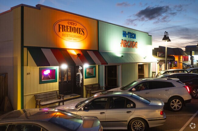 Brightly colored businesses sit along Kure Beach Downtown Preservation District.