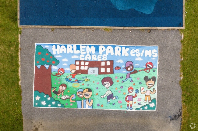 A mural at Harlem Park Elementary School evokes the spirit of play.