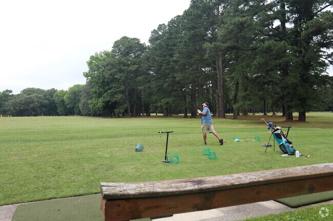 Golfer warming up at the Stumpy Lake Golf Course in the Stumpy Lake Natural Area.