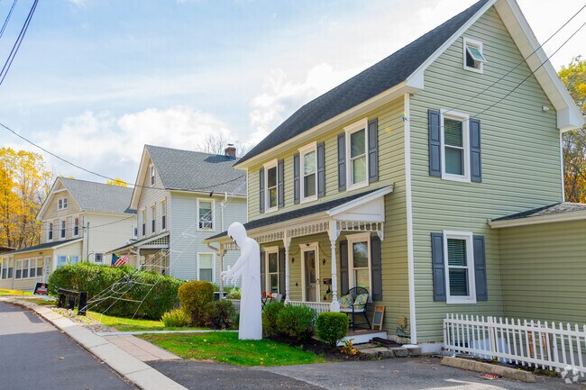 Landscaped yards line residential streets across Clinton Township.