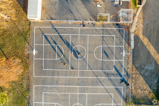 Students play basketball after school at Calvine High School.