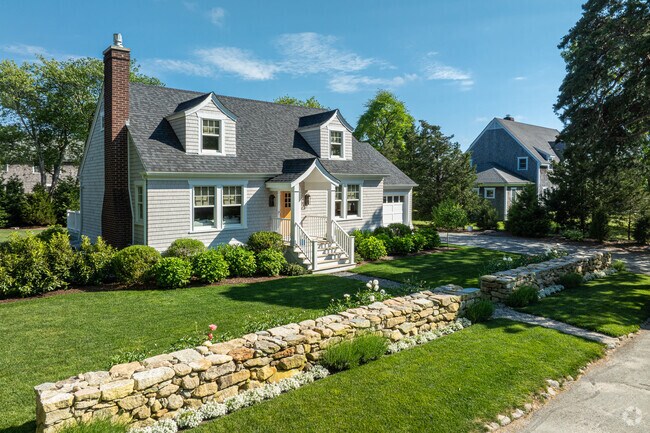 Vintage cape cods line South Dartmouth with well manicured lawns and front yard mansonry.