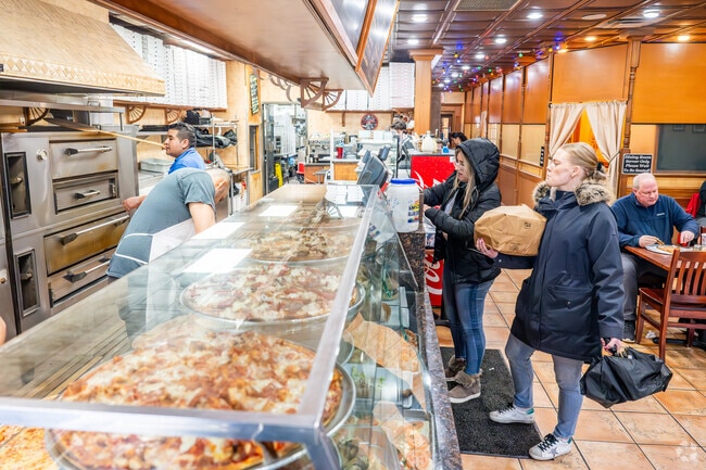 Village Pizzeria in Floral Park offers hot slices and Italian favorites near Bellerose Terrace.