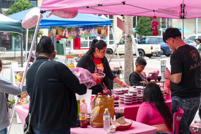 At Pearland Town Square, locals explore outdoor shops for leisure and shopping.