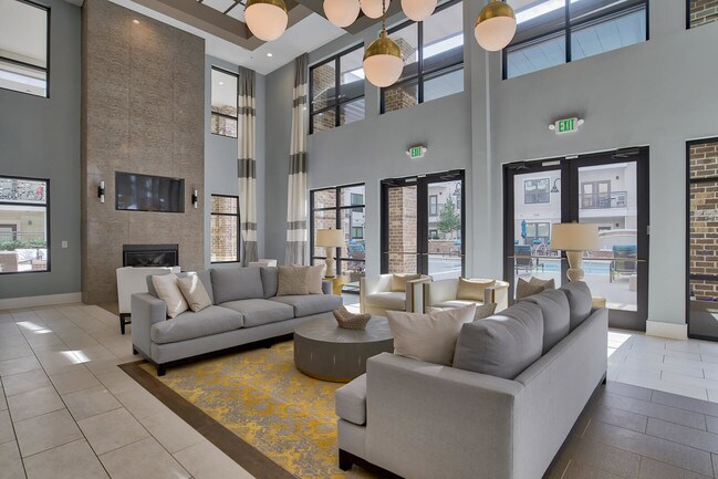 Lounge area, TVs and fire place in Entertainment Lounge