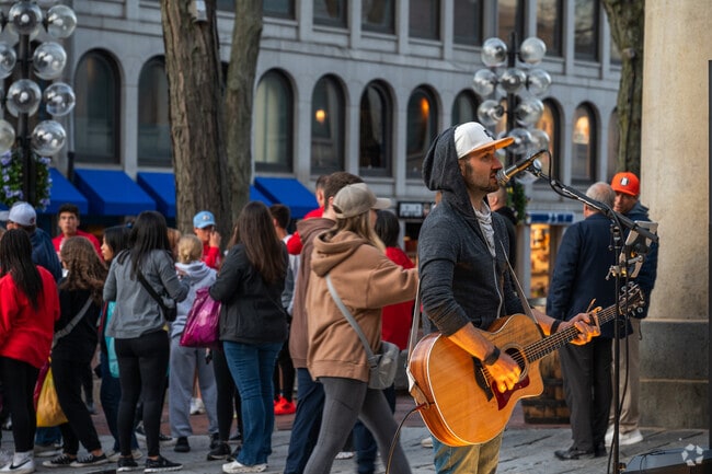 Enjoy live entertainment outside of Quincy Market in Downtown Boston.