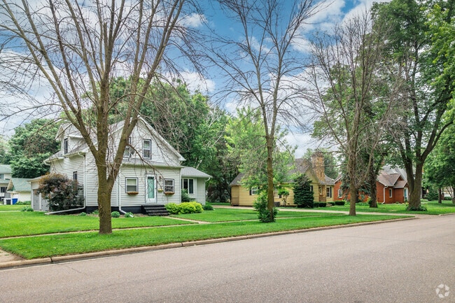 A quiet residential street in Sioux Center features a mix of bungalows and traditional homes.