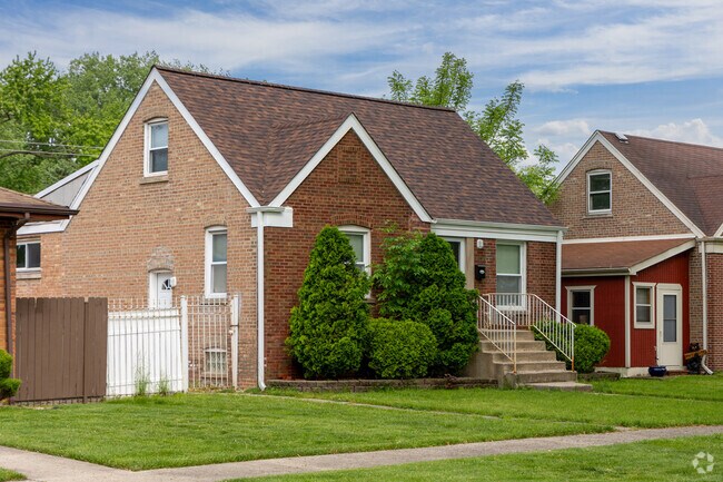 Minimal traditional brick homes with arched roofs with large yards are common in Burnham, IL.