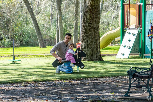 A father and daughter play on one of Friendswood's many playgrounds.
