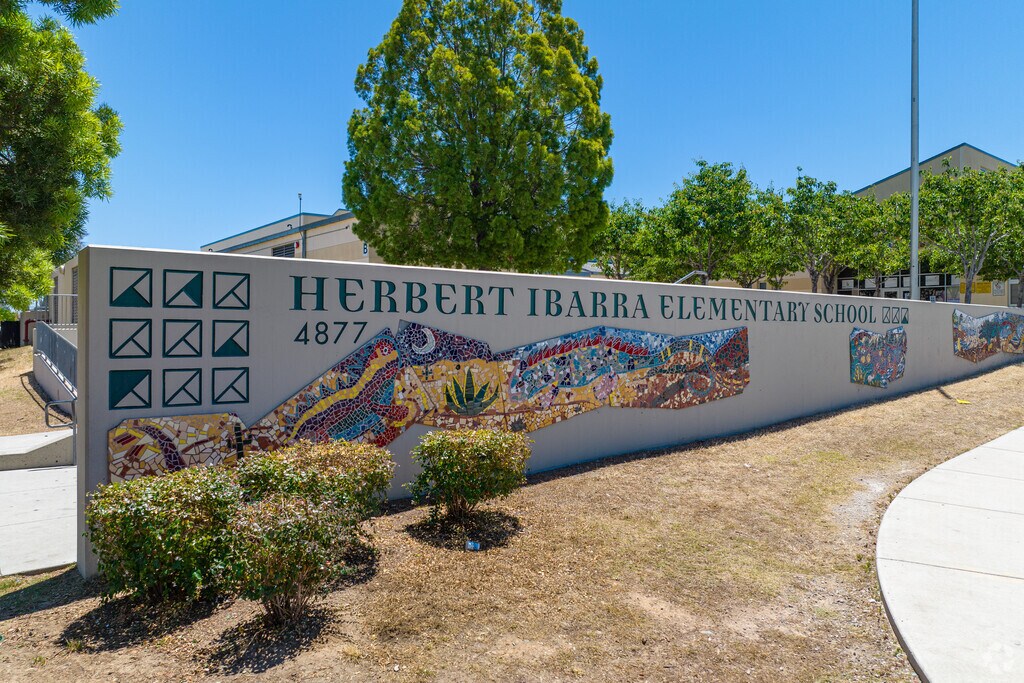 Ibarra Elementary School's welcoming sign features an artfully crafted mosaic.