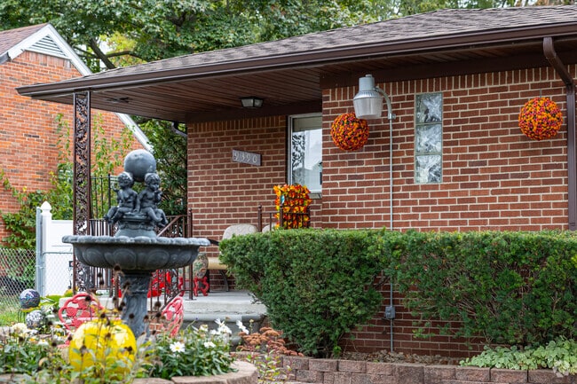 Franklin Park homes often feature stacked pavers, hedges and manicured lawns.
