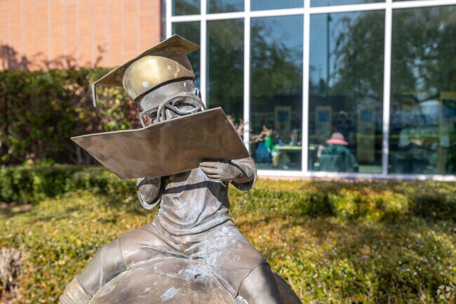 A whimsical statue greets visitors at the Foster City Library entrance near Edgewater Isle.
