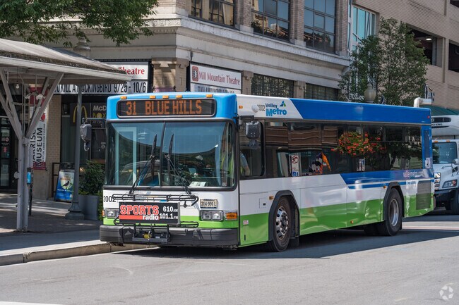 The metro buses run frequently throughout the neighborhood and the city.