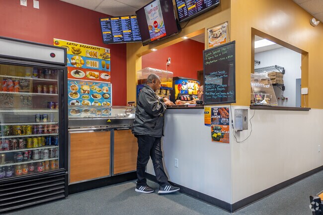 A resident orders delicious food from Missouri City's Latin Delight.