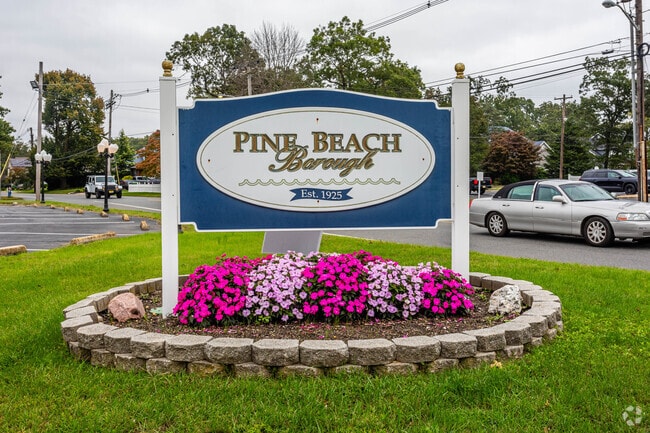 The welcome sign is adorned with beautiful flowers in Pine Beach, NJ.
