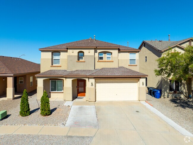 Two-story stucco homes in Tuscany often include garages.