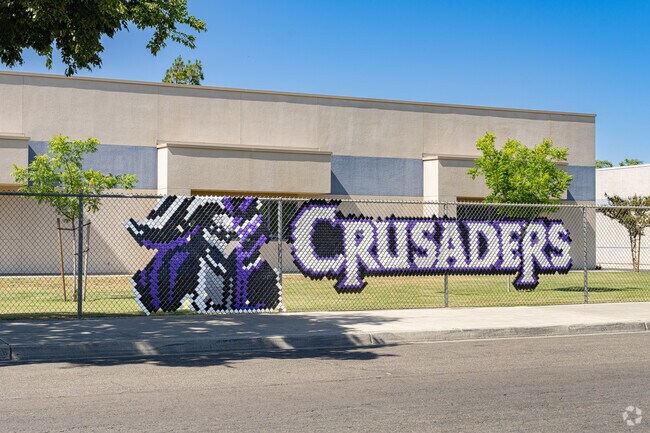 The Martin Luther King Jr. Elementary School mascot is featured on the front fence.