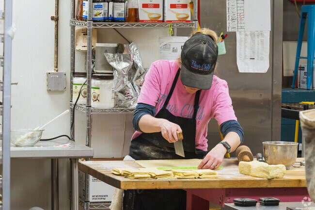 One of the bakers at Flour Child Bakery prepares fresh treats in Grand Ledge.