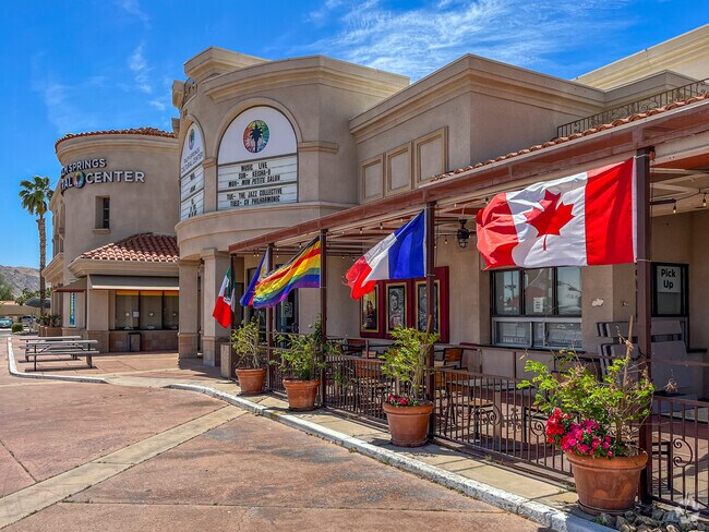 The Palm Springs Cultural Center in Sunrise Park has various flags flying outside.