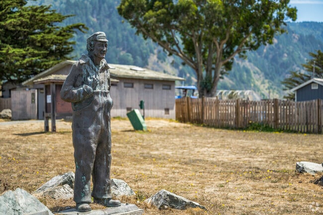 A fisherman monument welcomes you to the community of Shelter Cove.