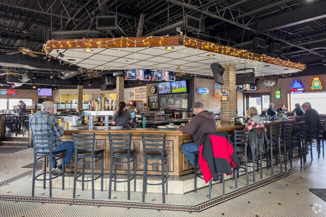 Big Louie's Bar and Grill has a wraparound bar with a tap selection.